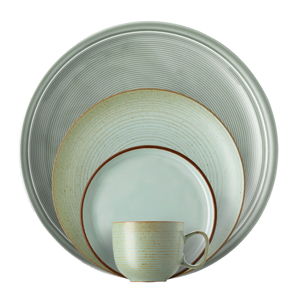 Various green dishes stacked in front of each other