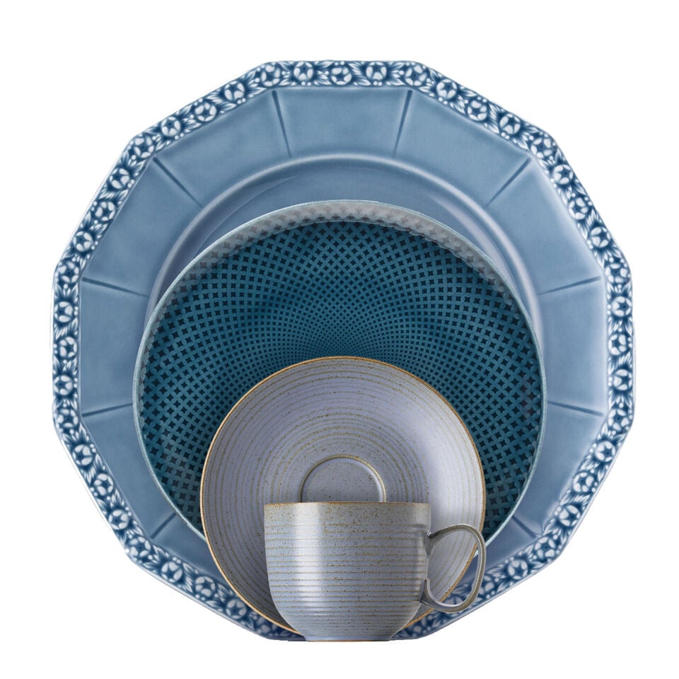 Various blue dishes stacked in front of each other