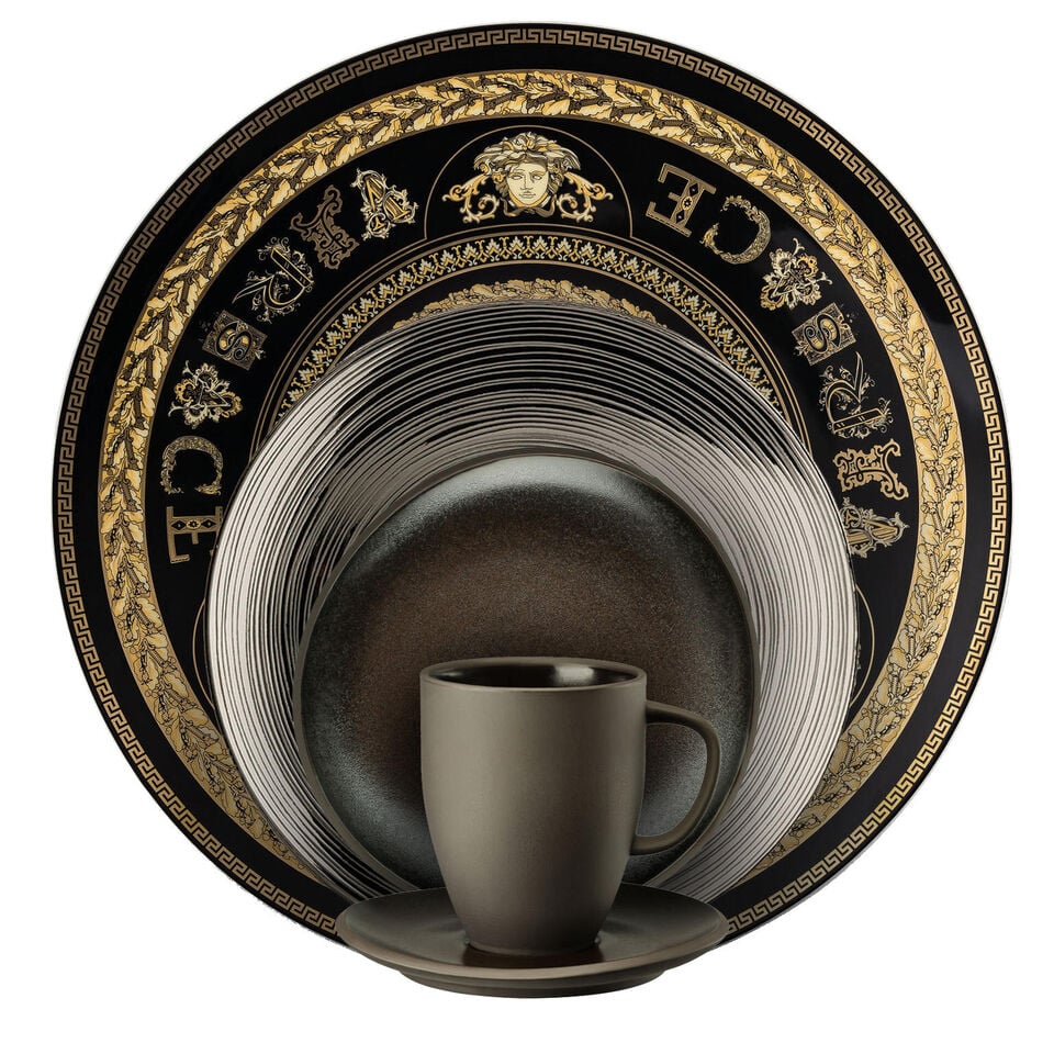 Various black dishes stacked in front of each other