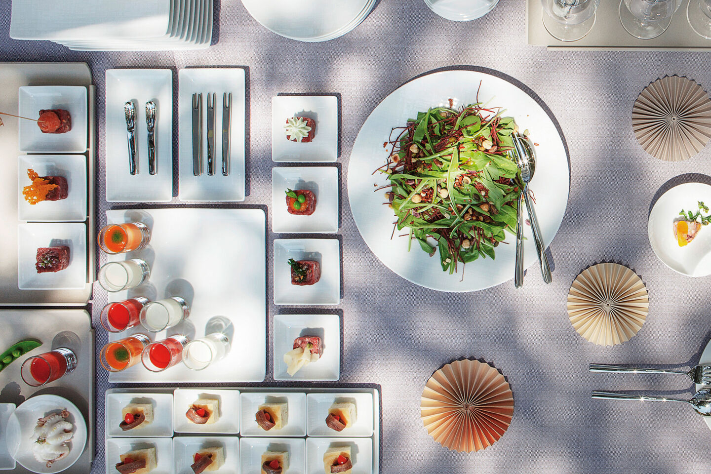 a buffet table set with rosenthal Blend bowls and cups and a picture of jazz music player on the wall as eye chatcher