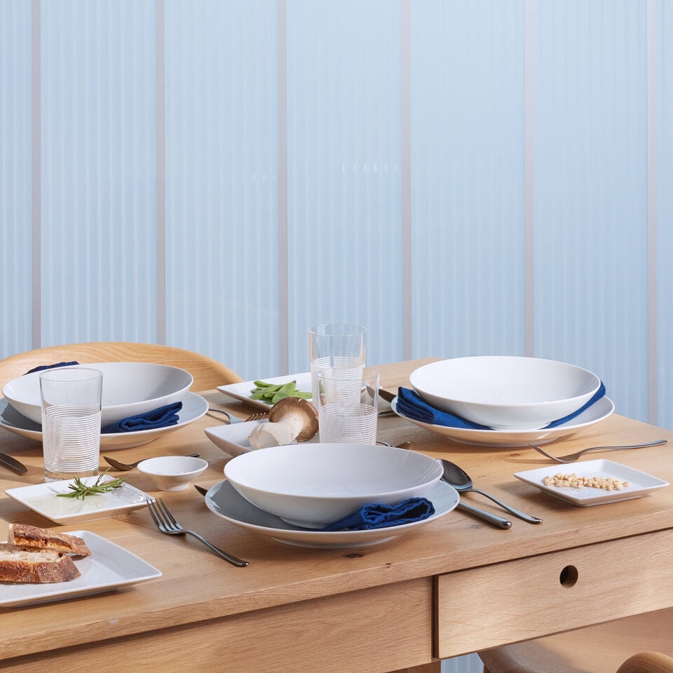 Thomas by Rosenthal Varia White coffee table setting on rustic wooden table with colorful decorations.