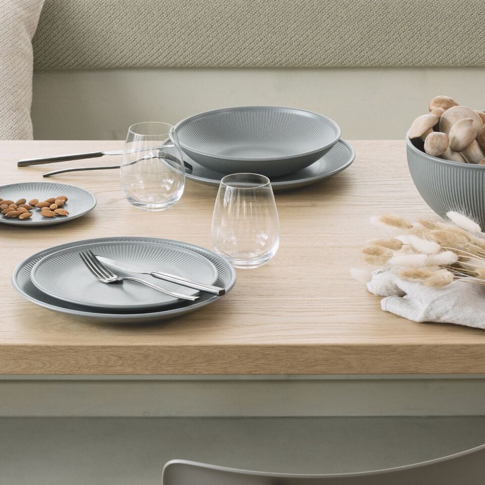 osenthal A La Carte set of 3, white dishes stacked on brown surface.