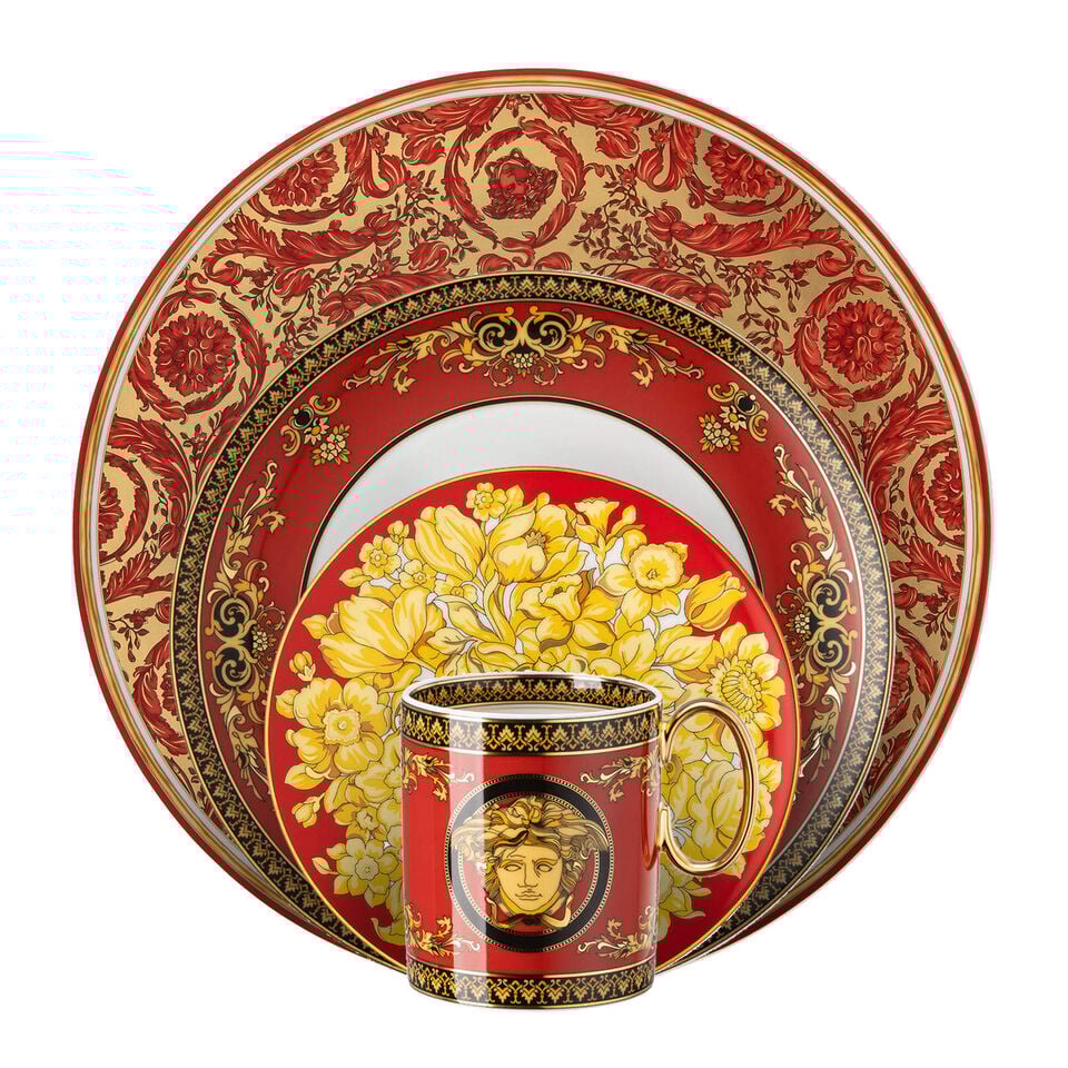 Various red dishes stacked in front of each other