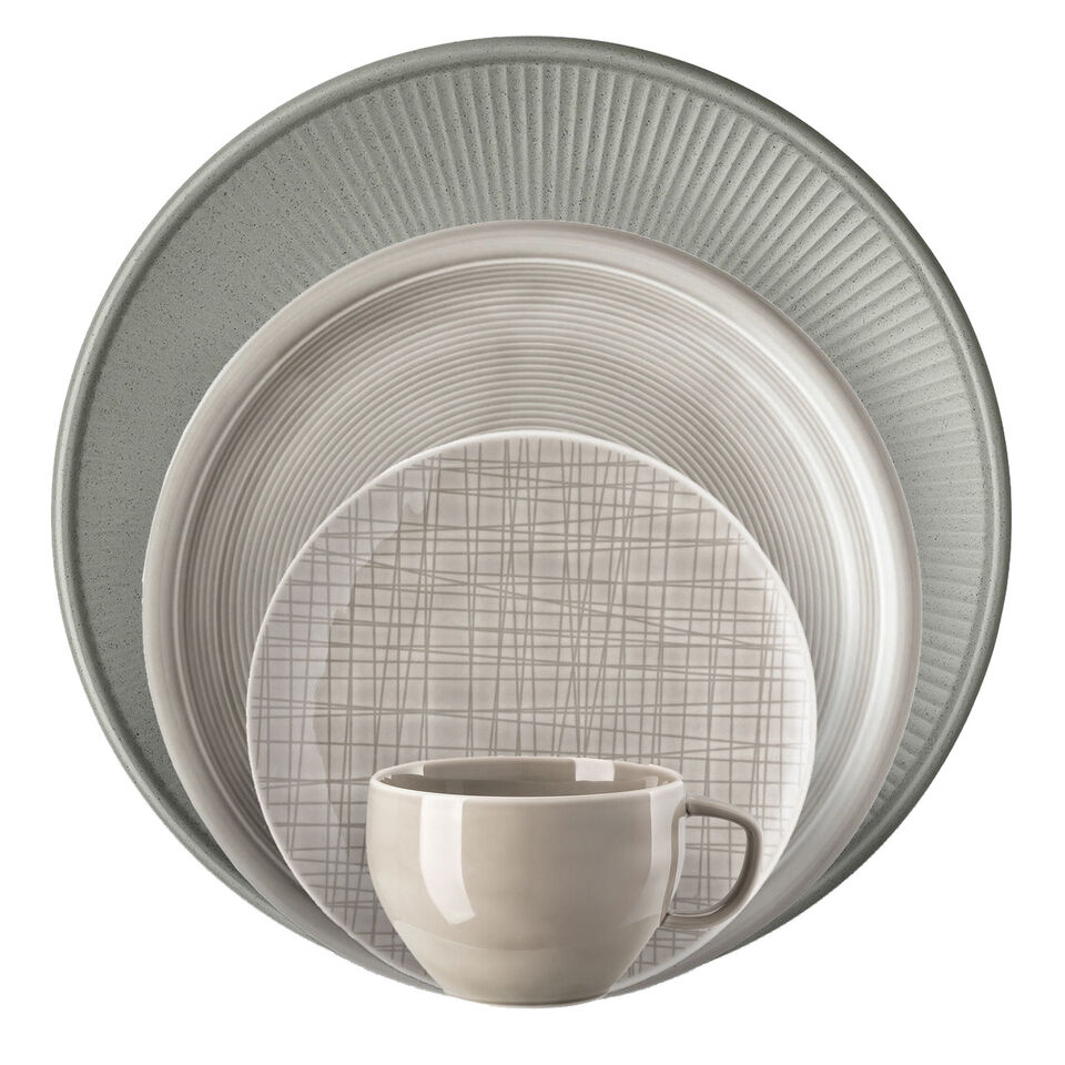 Various gray dishes stacked in front of each other