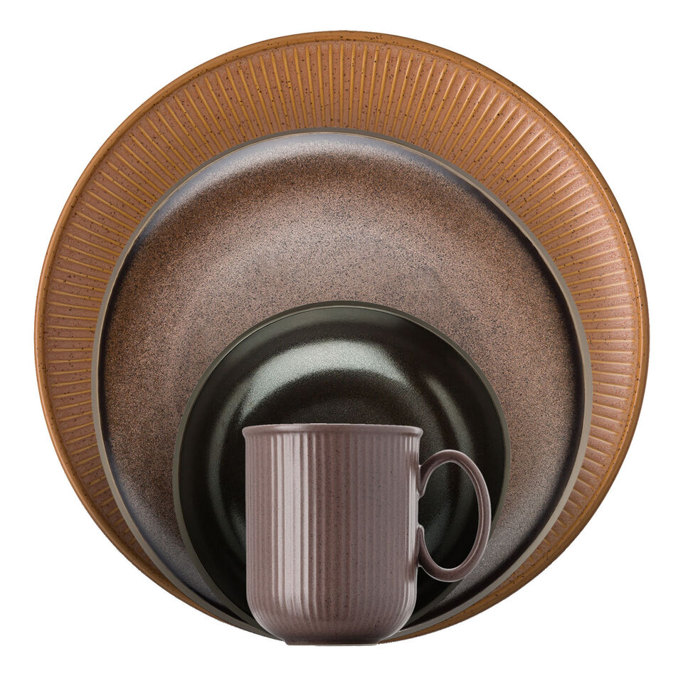 Various brown dishes stacked in front of each other