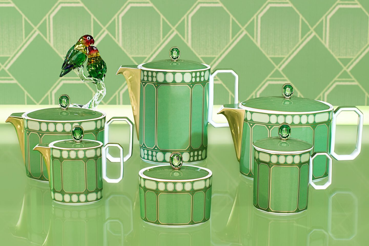 Green dishes with green cake and cookies on green background