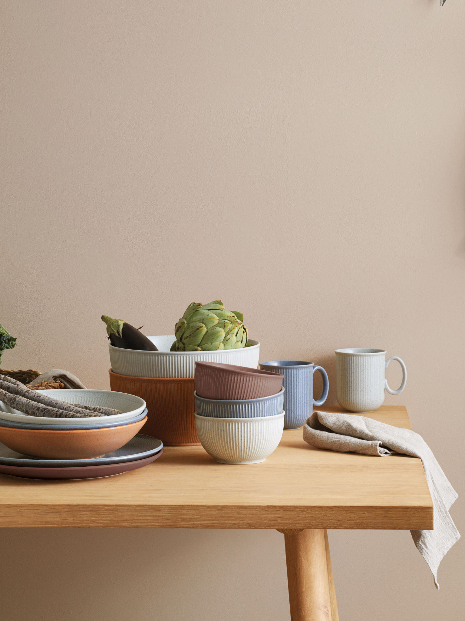 Thomas Clay items stacked on a wooden table