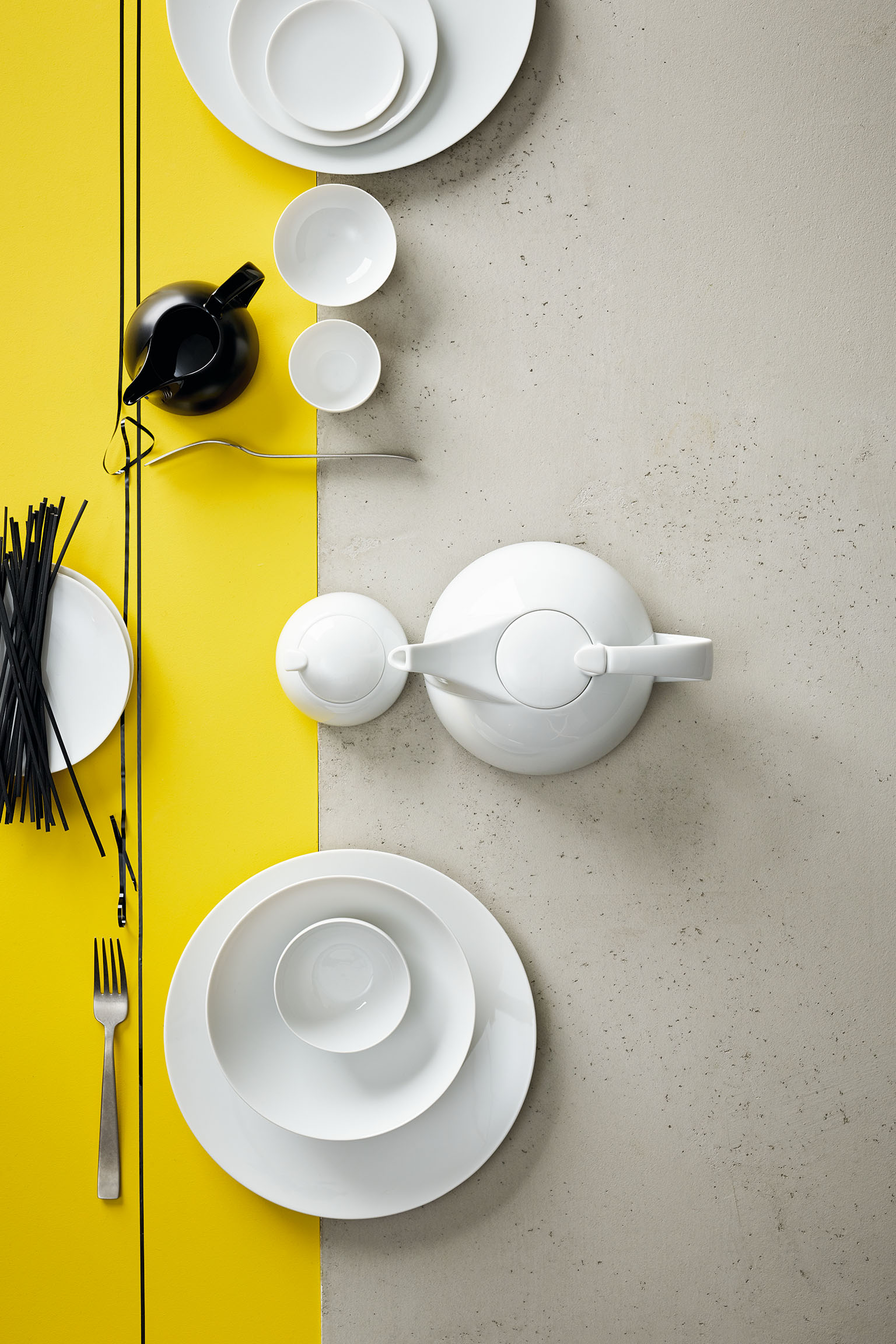 Rosenthal TAC White collection on a yellow-grey striped background