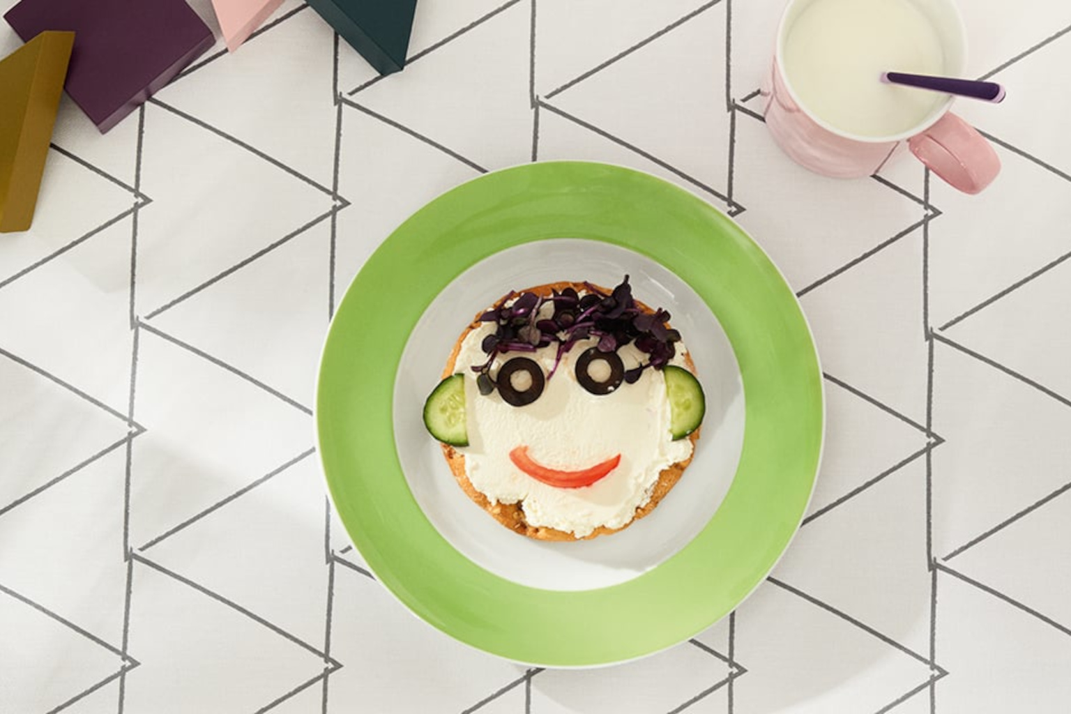 Thomas Sunny Day Apple Green plate with funny face arranged of bread and vegetables